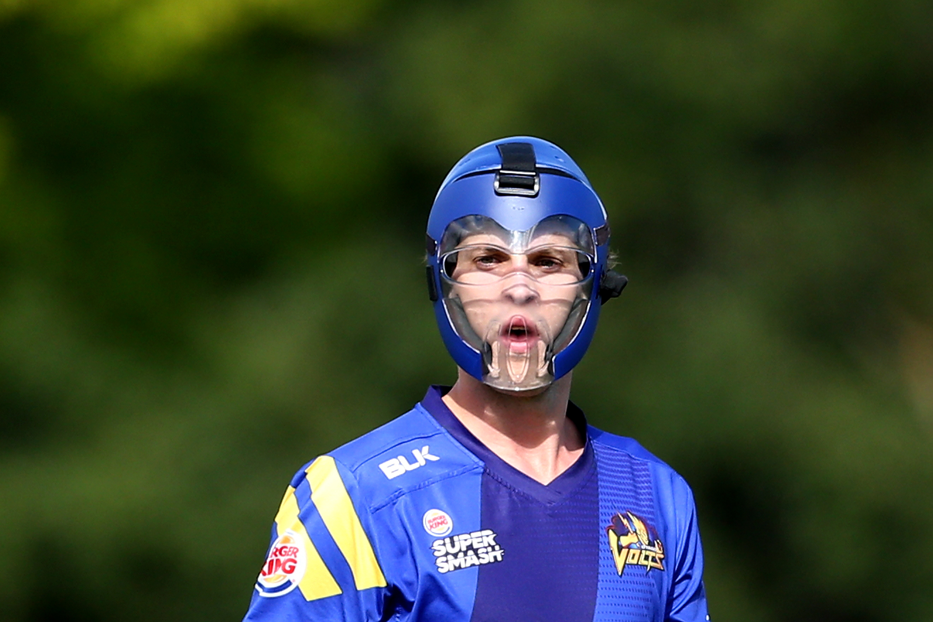 Otago pacer Warren Barnes wears protective bowling headgear during Super Smash T20