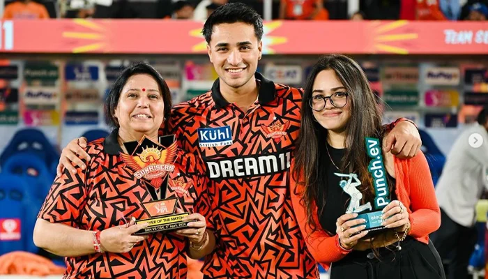 Abhishek Sharma in a post-match ceremony with his mother and sister.