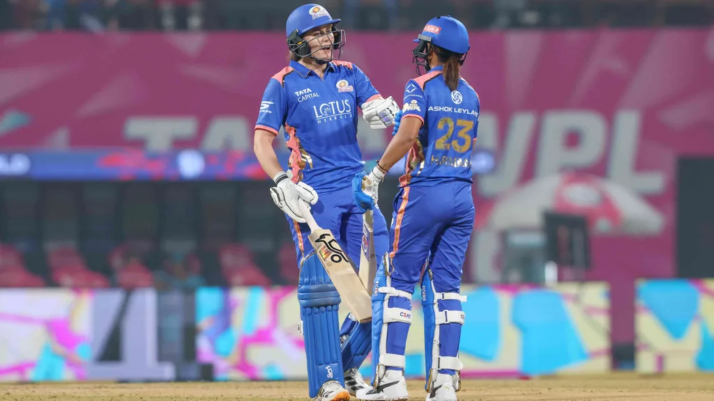 Mumbai Indians skipper Harmanpreet Kaur and Nat Sciver-Brunt during their partnership against Delhi Capitals in the WPL 2025-26 match in Navi Mumbai.