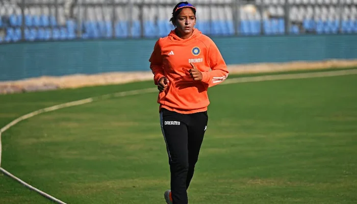 Harmanpreet Kaur training on the pitch.