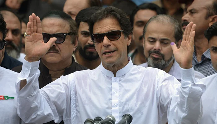 Imran Khan giving a speech at a political gathering.