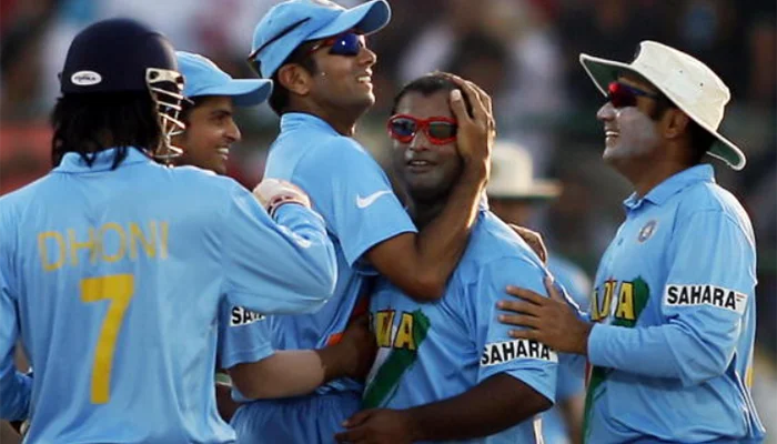 Indian players celebrating after having the wicket of Kamran Akmal.