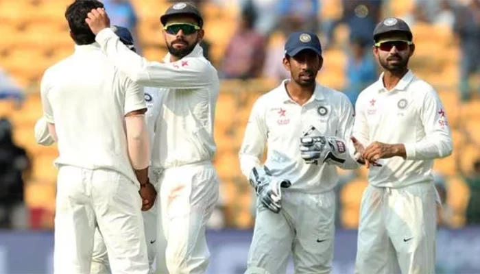 Indian team celebrating after taking a wicket of Australian batter in Bangalore test match.