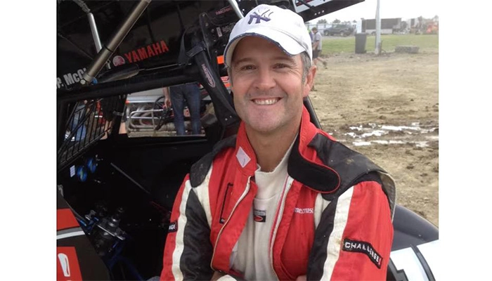 Nathan Astle posing with his modified sprint car for a media pic.