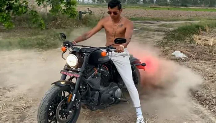 Navdeep Saini, performing a burnout with his Harley Davidson Roadster.