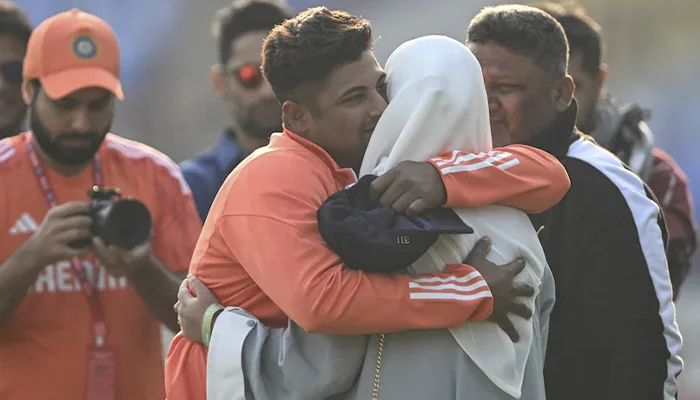 Sarfaraz Khan sharing an emotional moment with his parents in the post match ceremony of his debut match.