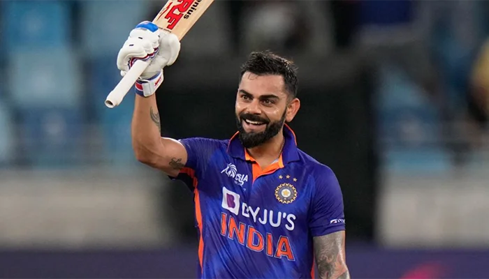 Virat Kohli celebrates after scoring his maiden T20 century against Afghanistan.