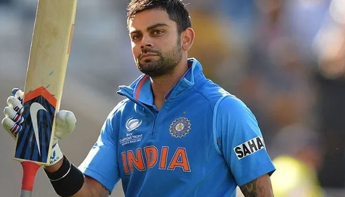 Virat Kohli using a Nike sticker on his bat.