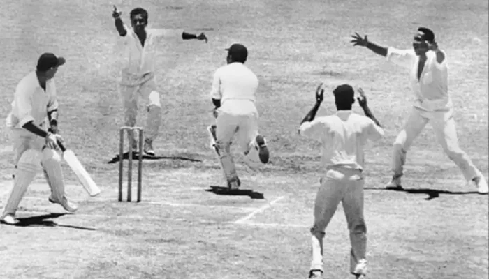 West Indies players celebrating after dismissing an England batter.