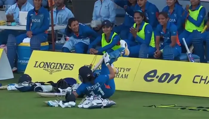 Yastika Bhatia tumbles over the advertisement board, bringing smiles to her teammates.