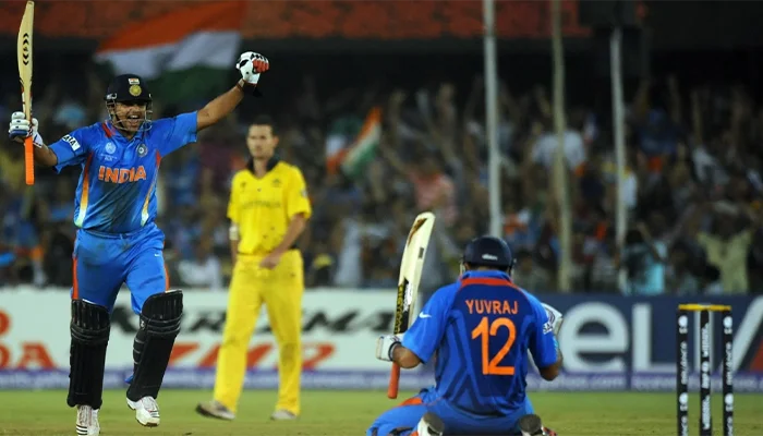 Yuvraj Singh and Suresh Raina celebrate after winning the match against Australia.